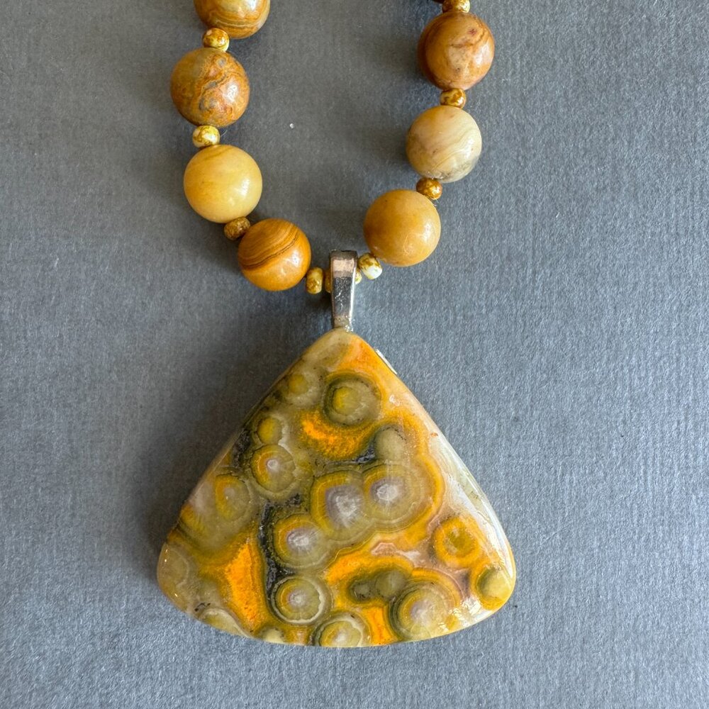 Orbicular Jasper Pendant strung with coral fossil beads